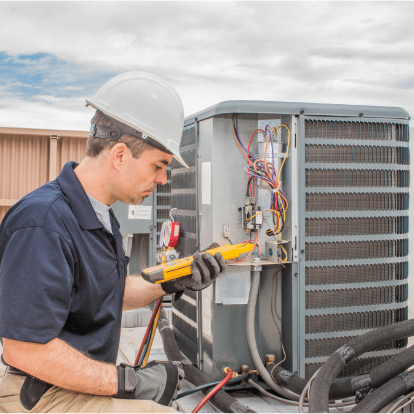 Stratford Heating & Cooling HVAC technician servicing a system