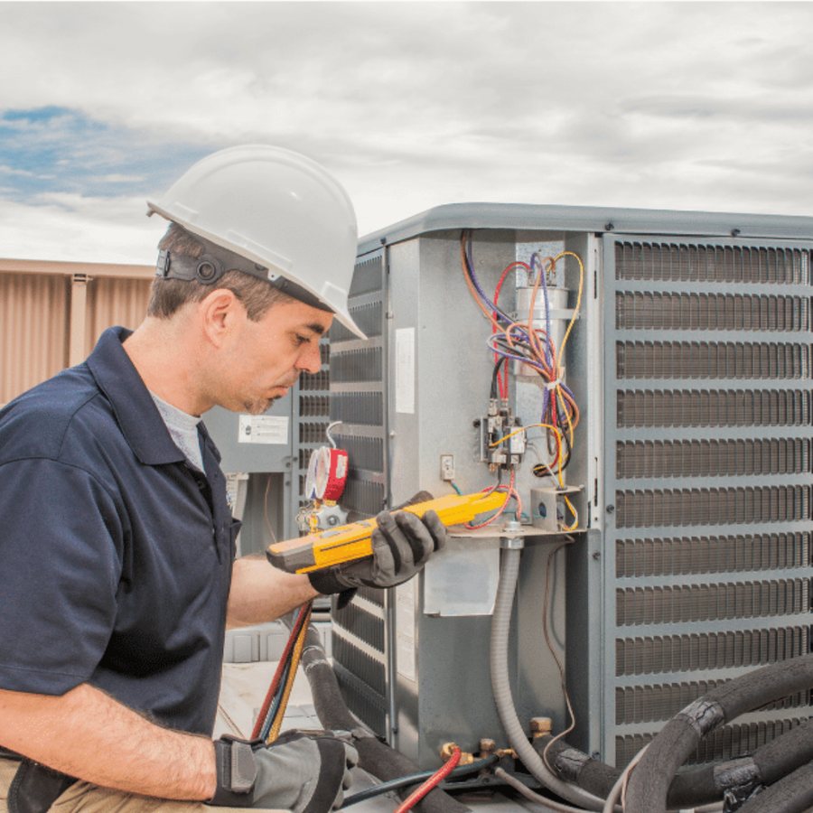 Stratford Heating & Cooling HVAC technician servicing a system